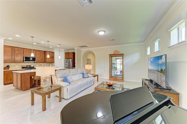 6756 Chester Trl, Lakewood Ranch, FL 34202 - living area featuring arched walkways, ornamental molding, recessed lighting, and baseboards
