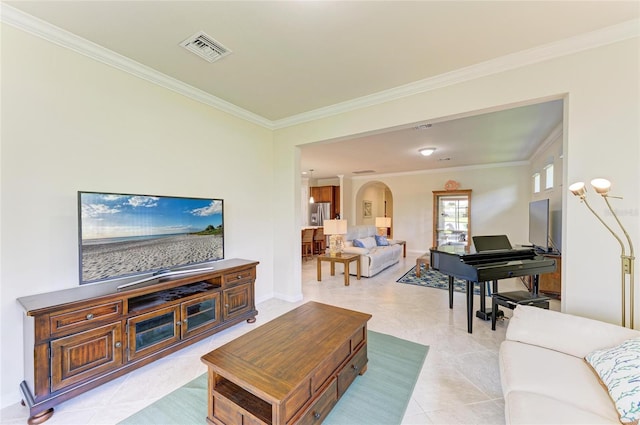 6756 Chester Trl, Lakewood Ranch, FL 34202 - living room featuring arched walkways, ornamental molding, baseboards, and light tile patterned floors