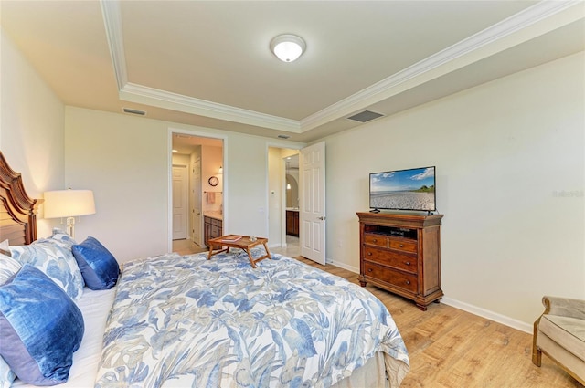 6756 Chester Trl, Lakewood Ranch, FL 34202 - bedroom featuring a tray ceiling, light wood-style floors, crown molding, baseboards, and ensuite bathroom
