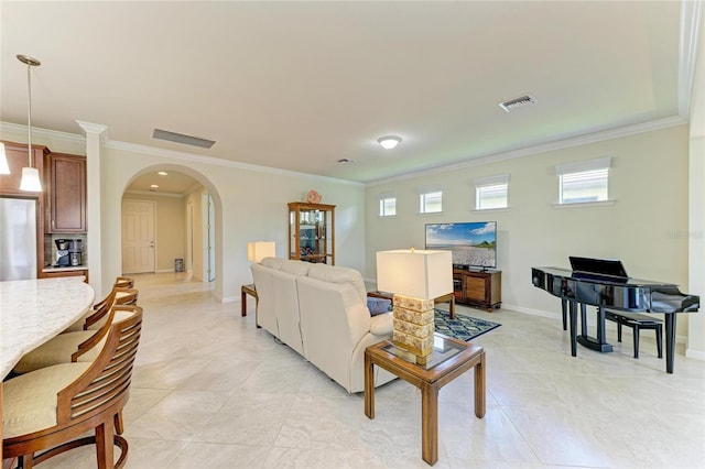 6756 Chester Trl, Lakewood Ranch, FL 34202 - living area featuring arched walkways, ornamental molding, baseboards, and light tile patterned floors