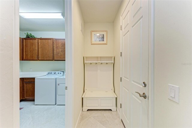 6756 Chester Trl, Lakewood Ranch, FL 34202 - laundry area with cabinet space, separate washer and dryer, light tile patterned flooring, and baseboards