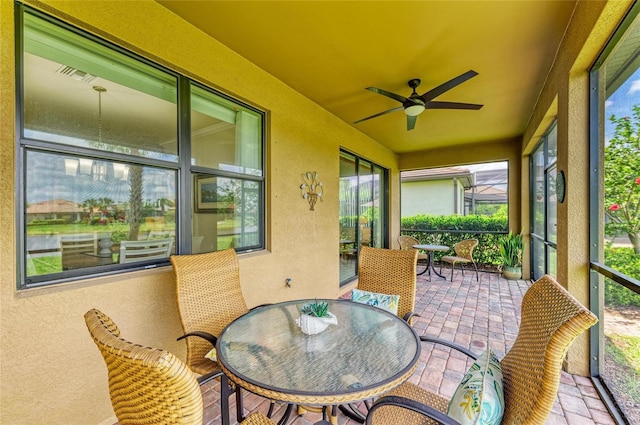 6756 Chester Trl, Lakewood Ranch, FL 34202 - sunroom with a ceiling fan and outdoor dining space