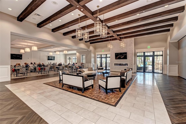 6756 Chester Trl, Lakewood Ranch, FL 34202 - community lobby featuring beam ceiling, a decorative wall, and wainscoting