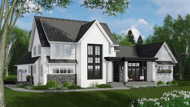 4704 Riverwood Ave, Sarasota, FL 34231 - rear view of house with a standing seam roof and stone siding