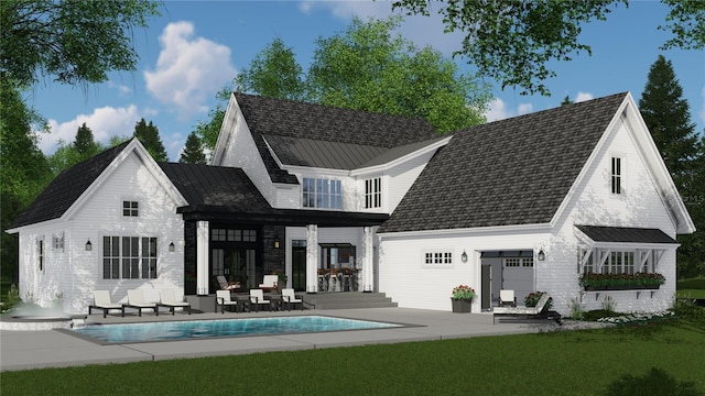 4704 Riverwood Ave, Sarasota, FL 34231 - back of house with a patio area, an outdoor pool, and a lawn