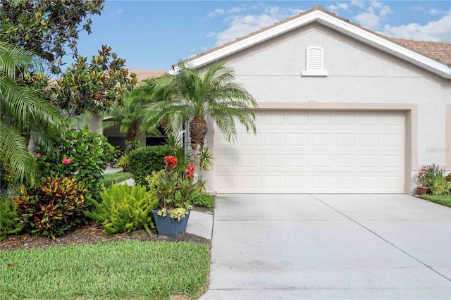 8224 Simpson Falls Ct Unit 8224, Sarasota, FL 34243 - view of front of home with concrete driveway, a garage, and stucco siding