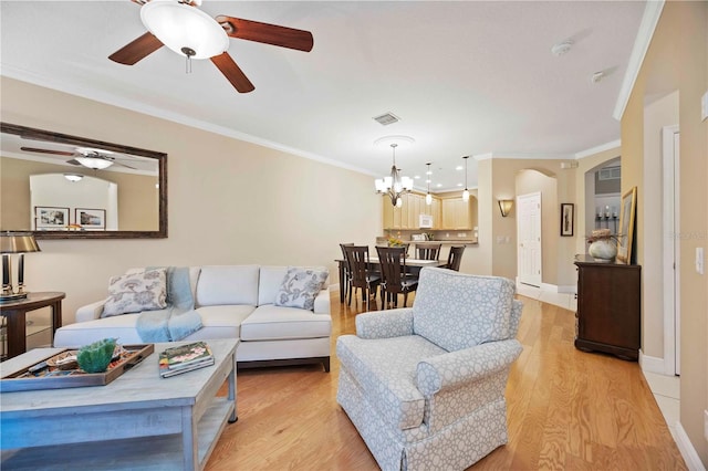 8224 Simpson Falls Ct Unit 8224, Sarasota, FL 34243 - living area featuring ornamental molding, ceiling fan, light wood-style floors, a chandelier, and baseboards