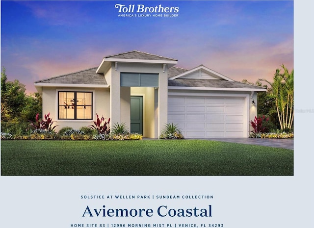 12996 Morning Mist Pl, Venice, FL 34293 - view of front of property with an attached garage, driveway, a lawn, and stucco siding