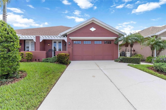 7314 Hamilton Rd, Bradenton, FL 34209 - view of front facade with concrete driveway, a garage, and stucco siding