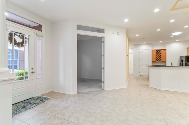 7314 Hamilton Rd, Bradenton, FL 34209 - entryway with light tile patterned floors and recessed lighting