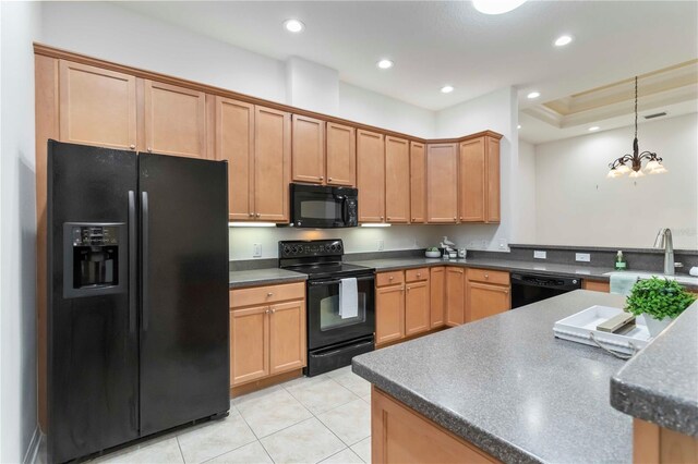 7314 Hamilton Rd, Bradenton, FL 34209 - kitchen with black appliances, dark countertops, light tile patterned floors, and recessed lighting