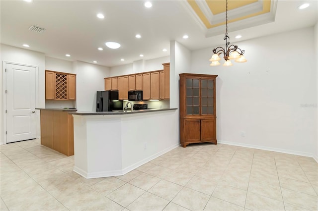 7314 Hamilton Rd, Bradenton, FL 34209 - kitchen with black appliances, recessed lighting, crown molding, a chandelier, and dark countertops