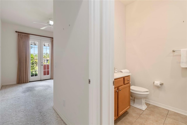 7314 Hamilton Rd, Bradenton, FL 34209 - bathroom with vanity, ceiling fan, french doors, and tile patterned flooring