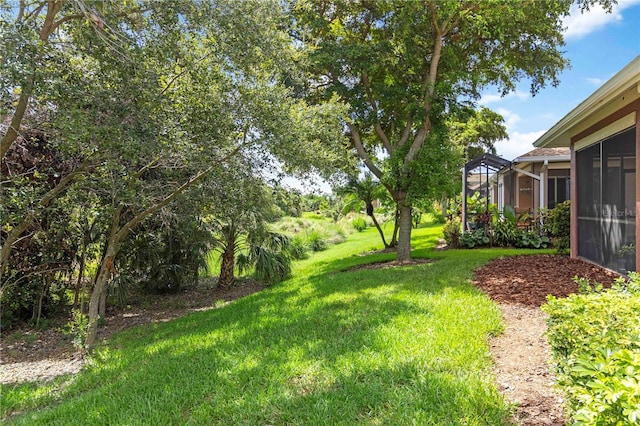 7314 Hamilton Rd, Bradenton, FL 34209 - view of grassy yard with a sunroom