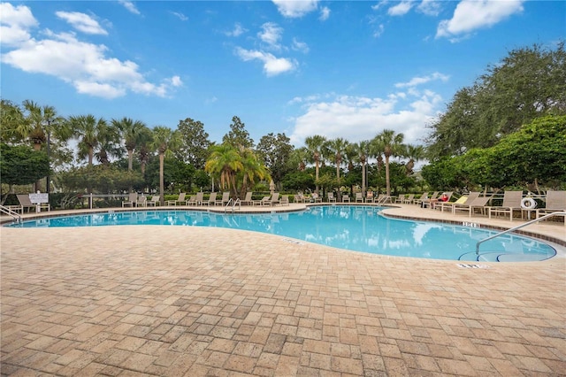 7314 Hamilton Rd, Bradenton, FL 34209 - community pool with a patio area and view of wooded area