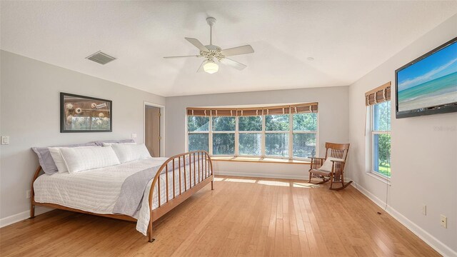4771 Riverwood Cir, Sarasota, FL 34231 - bedroom featuring light wood-type flooring and ceiling fan