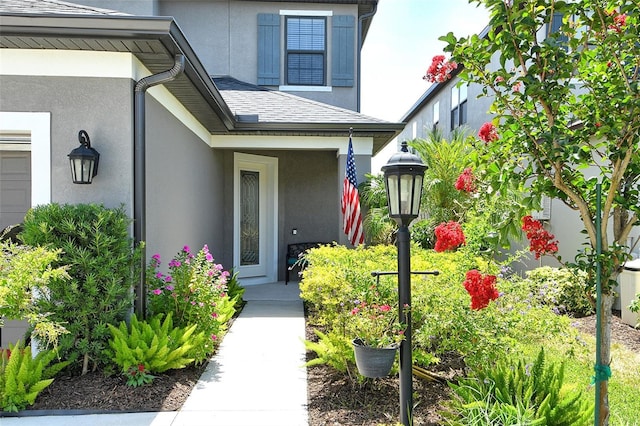 5475 Summit Gln, Bradenton, FL 34203 - property entrance with stucco siding and a shingled roof