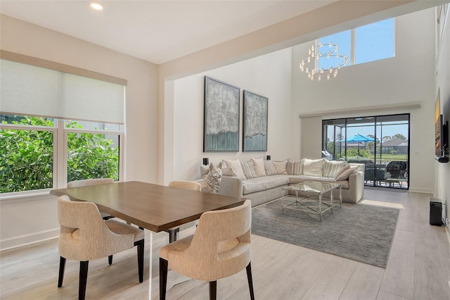 5475 Summit Gln, Bradenton, FL 34203 - dining space featuring a chandelier, light wood-type flooring, baseboards, and recessed lighting