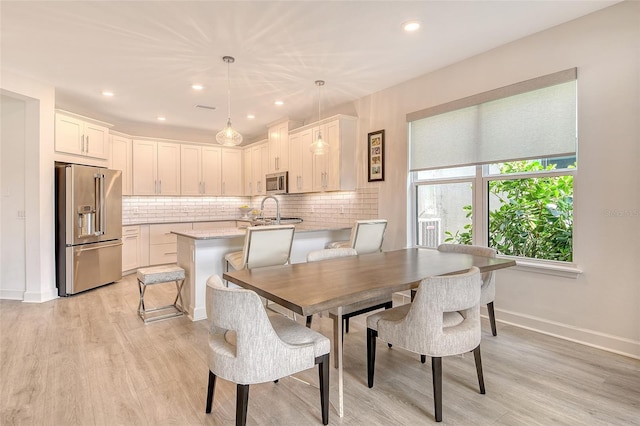 5475 Summit Gln, Bradenton, FL 34203 - dining room with light wood finished floors, baseboards, and recessed lighting