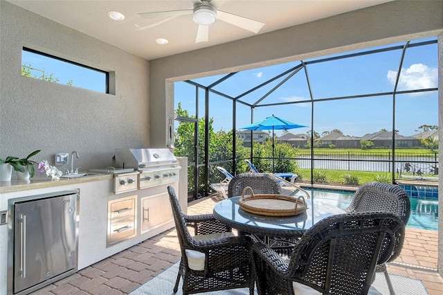5475 Summit Gln, Bradenton, FL 34203 - view of patio / terrace featuring a water view, ceiling fan, glass enclosure, and an outdoor pool