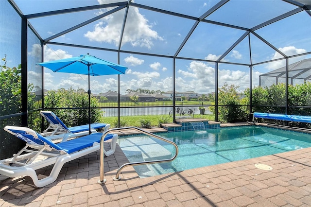 5475 Summit Gln, Bradenton, FL 34203 - outdoor pool featuring a water view, a jacuzzi, glass enclosure, and a patio