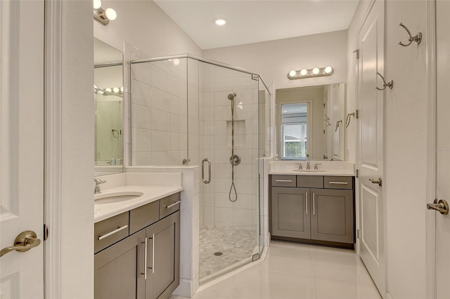 5475 Summit Gln, Bradenton, FL 34203 - full bathroom with tile patterned floors, a shower stall, and two vanities