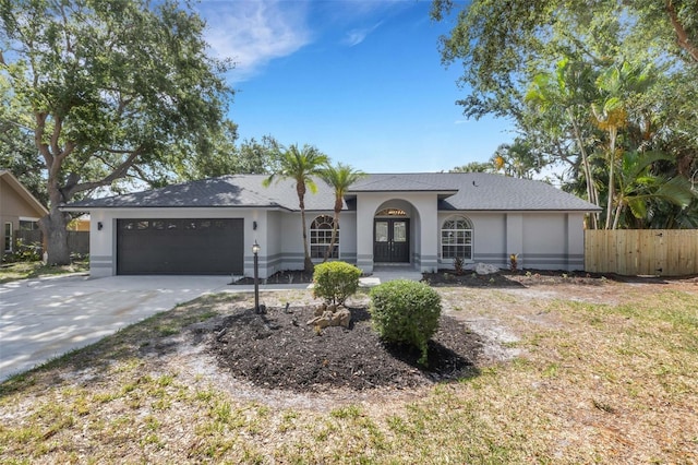 4473 Diamond Cir S, Sarasota, FL 34233 - ranch-style home with a garage, driveway, and stucco siding