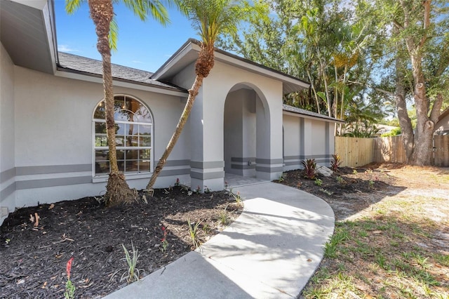 4473 Diamond Cir S, Sarasota, FL 34233 - doorway to property with stucco siding and roof with shingles