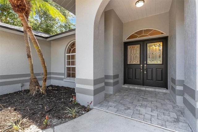 4473 Diamond Cir S, Sarasota, FL 34233 - entrance to property featuring stucco siding and french doors