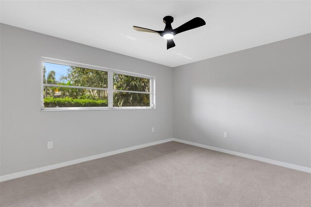 4473 Diamond Cir S, Sarasota, FL 34233 - empty room with carpet floors, a ceiling fan, and baseboards