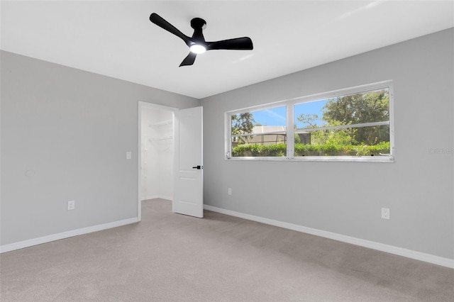 4473 Diamond Cir S, Sarasota, FL 34233 - spare room with light carpet, baseboards, and ceiling fan
