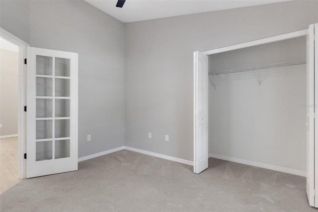 4473 Diamond Cir S, Sarasota, FL 34233 - unfurnished bedroom featuring carpet, a closet, baseboards, and ceiling fan
