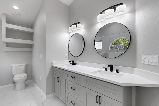4473 Diamond Cir S, Sarasota, FL 34233 - full bath featuring double vanity, toilet, marble look tiles, and baseboards