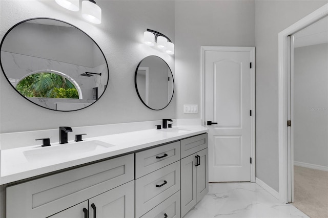 4473 Diamond Cir S, Sarasota, FL 34233 - bathroom with double vanity, marble look tiles, and baseboards