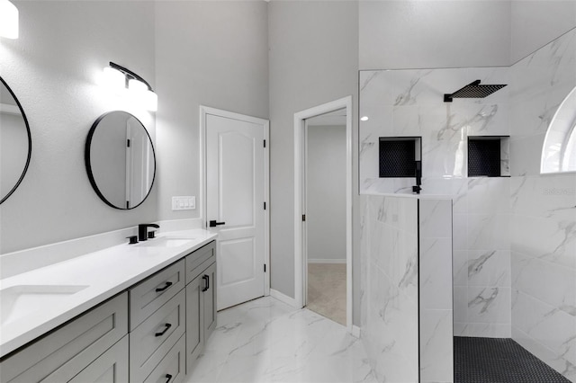 4473 Diamond Cir S, Sarasota, FL 34233 - bathroom featuring marble tiled floors, double vanity, a marble finish shower, baseboards, and a towering ceiling