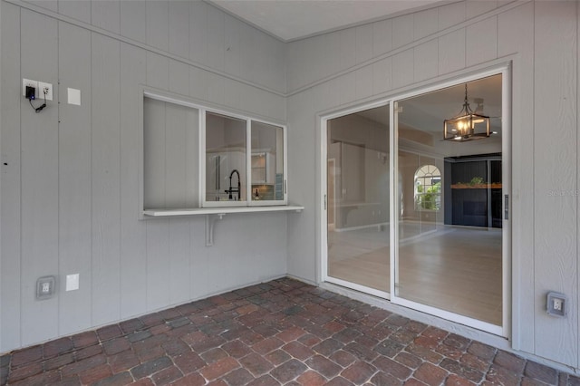 4473 Diamond Cir S, Sarasota, FL 34233 - unfurnished sunroom with a chandelier