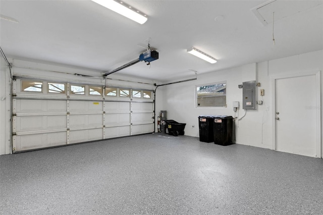 4473 Diamond Cir S, Sarasota, FL 34233 - garage featuring electric panel and a garage door opener