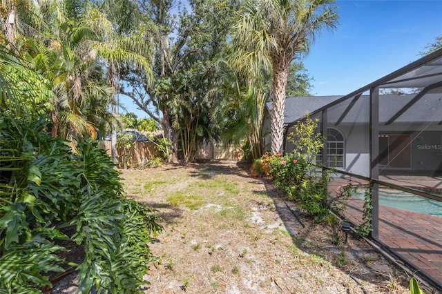 4473 Diamond Cir S, Sarasota, FL 34233 - fenced backyard with a patio area and a lanai