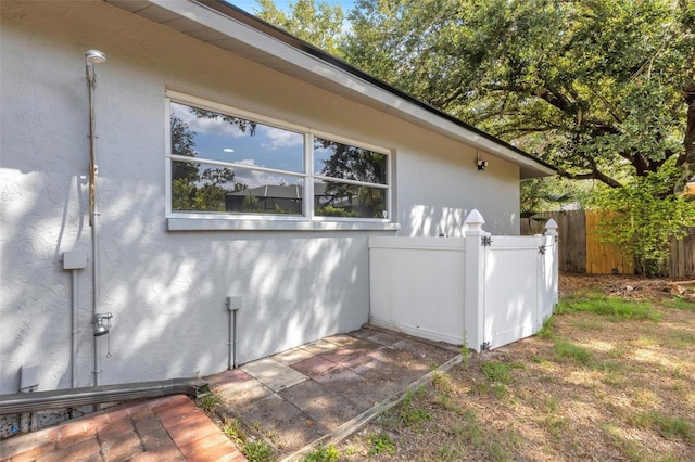 4473 Diamond Cir S, Sarasota, FL 34233 - view of home's exterior with stucco siding
