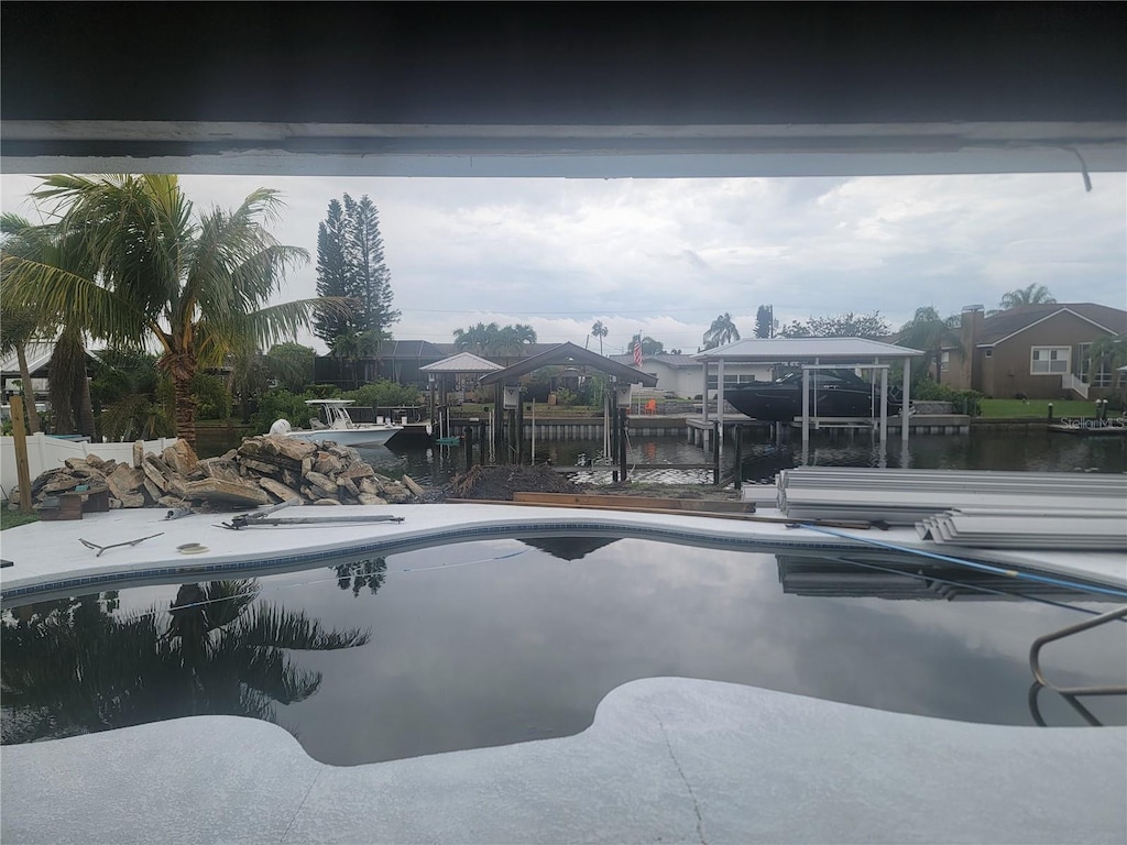 754 Gran Kaymen Way, Apollo Beach, FL 33572 - outdoor pool featuring a water view, a dock, and boat lift