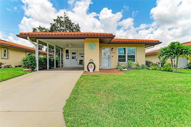 3213 Mercer Rd, Bradenton, FL 34207 - mediterranean / spanish home featuring driveway, stucco siding, and a front yard