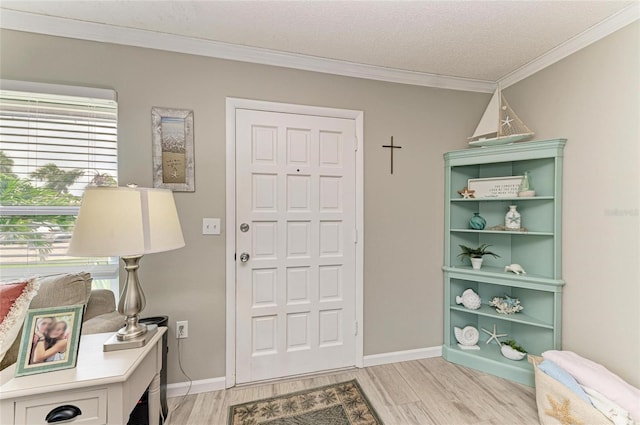 3213 Mercer Rd, Bradenton, FL 34207 - entryway with light wood-style floors, ornamental molding, baseboards, and a textured ceiling