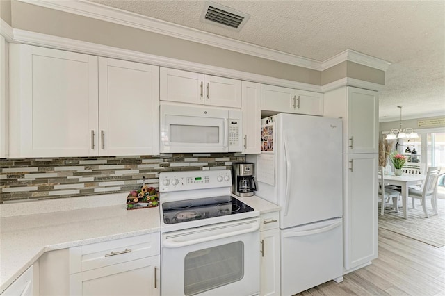 3213 Mercer Rd, Bradenton, FL 34207 - kitchen featuring white appliances, a textured ceiling, backsplash, white cabinets, and crown molding