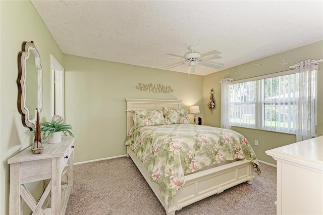 3213 Mercer Rd, Bradenton, FL 34207 - bedroom featuring light carpet, a textured ceiling, baseboards, and a ceiling fan