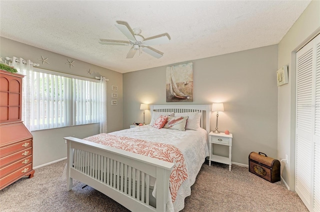 3213 Mercer Rd, Bradenton, FL 34207 - carpeted bedroom featuring a textured ceiling, a closet, baseboards, and ceiling fan