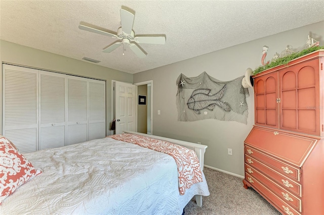 3213 Mercer Rd, Bradenton, FL 34207 - bedroom with light colored carpet, a textured ceiling, a closet, ceiling fan, and baseboards