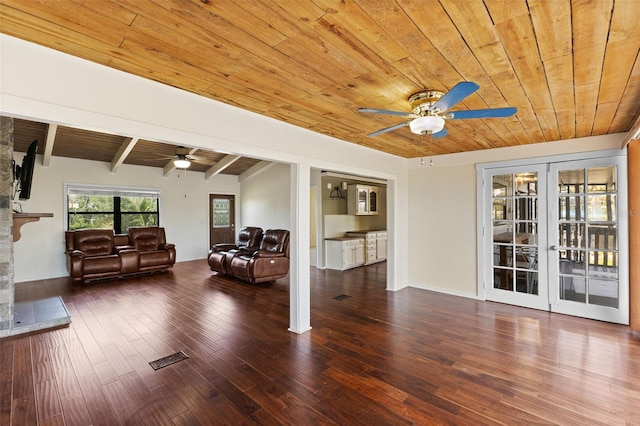 6406 Lincoln Rd, Bradenton, FL 34203 - living room featuring a ceiling fan, wood ceiling, french doors, hardwood / wood-style flooring, and a stone fireplace