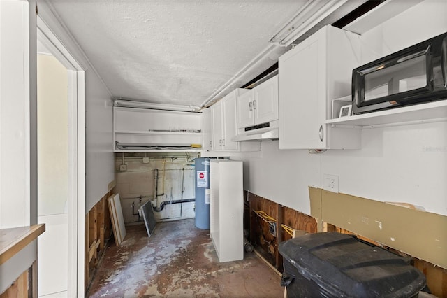 6406 Lincoln Rd, Bradenton, FL 34203 - basement with electric water heater and a textured ceiling