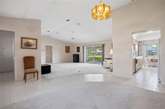 1654 Waxwing Ct, Venice, FL 34293 - unfurnished living room with light carpet, light tile patterned floors, lofted ceiling, baseboards, and a chandelier