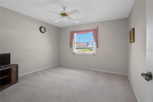 1654 Waxwing Ct, Venice, FL 34293 - empty room with light colored carpet, ceiling fan, and baseboards